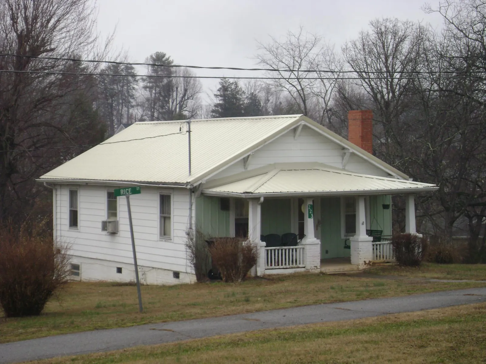 White metal roof on a craftsman bungalow at a street corner in Buena